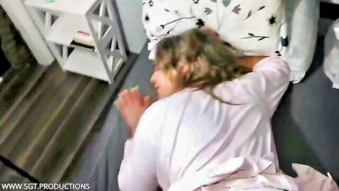 Blonde MILF lying on bed with pink robe open exposing curvy body and big tits