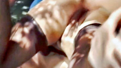 Blurry close-up of shadowed nude bodies embracing in swinger action, dirty housewife style