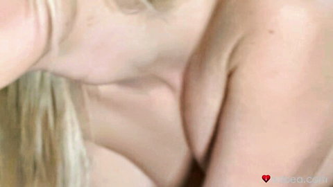 Blonde woman arching neck sensually exposing smooth shoulder and skin