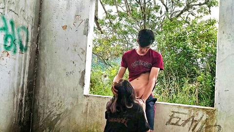 Amateur couple outdoor blowjob with Latina sucking hard cock in graffiti ruins