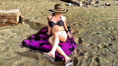 Kylee Nash in skimpy black bikini on beach, seductive pose
