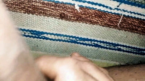 Hand on woven mat in raunchy gay femboy gangbang scene