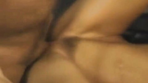 Blurry close-up of woman's spread pussy and ass cheeks exposing pink folds
