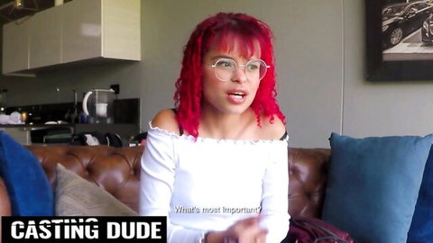 Nerdy ginger-haired Latina in glasses smiling in white top POV teaser