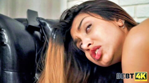 Roxy Lips topless with seductive pout in Debt4k adult scene