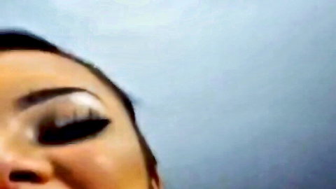 Close-up of Asian amateur woman with heavy makeup performing deep throat webcam suck
