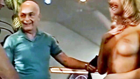 Blonde wife seduces bald friend, topless tease and smile