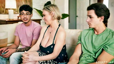Busty blonde stepmom flanked by two young studs on couch