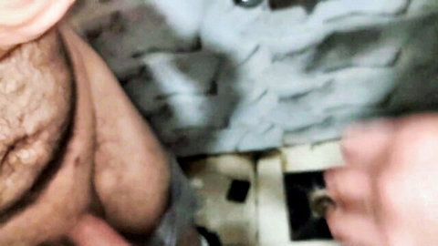 Hairy Middle Eastern man pulls down underwear exposing bushy cock base in bathroom POV