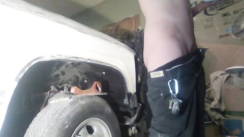 Shirtless gay guy pants down bare ass exposed bending over car in garage solo tease