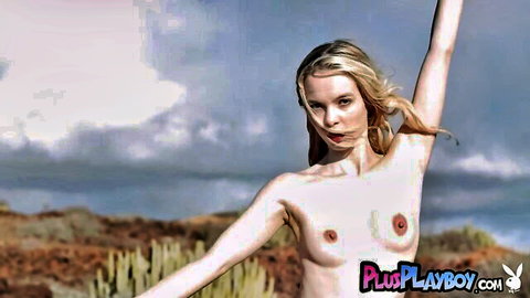 Petite blonde Emmi Wild nude outdoor pose exposing body