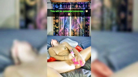 Nude MILF lying on bed with pink vibrator, inviting help for pleasure