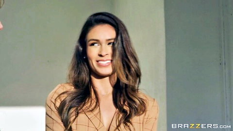 Katana Kombat smiles in sexy beige dress as real estate agent selling house