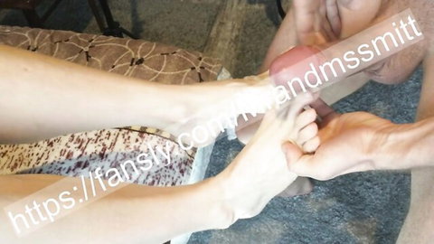 Man's hands gripping woman's bare legs and feet with cum dripping on thighs in foot fetish cumshot