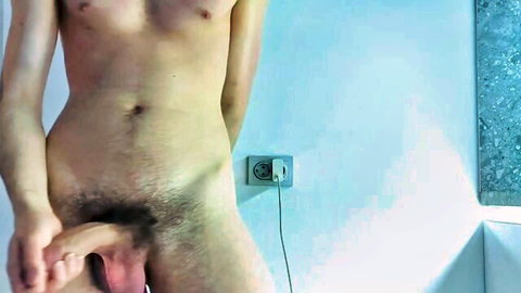 Nude man bending to self-suck his erect cock in solo amateur video