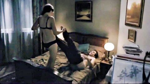 Big ass brunette in black lingerie pulls down guy's pants on bed