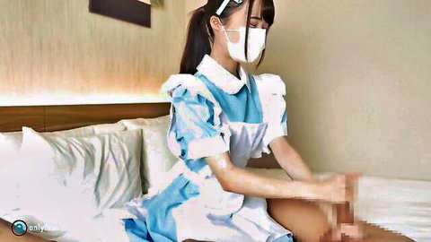 Petite Japanese maid in frilly blue cosplay gives blurry handjob on bed wearing face mask