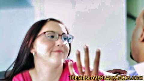 Spex brunette teen smiling with black stud in pink top