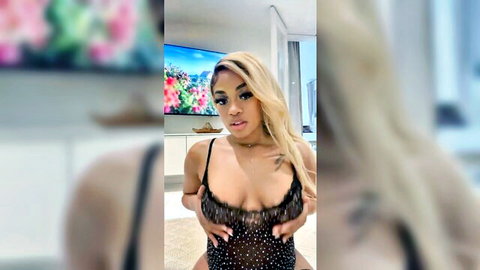 Irene live cam: Curvy blonde ebony beauty in sparkling low-cut top showing deep cleavage