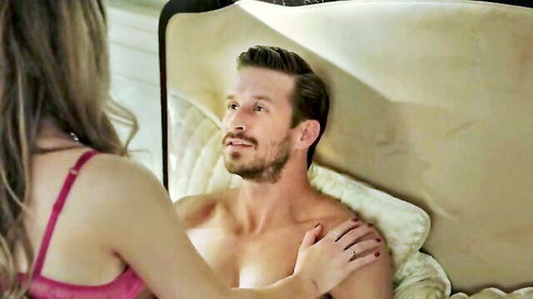 Elizabeth Gillies in pink lingerie seducing topless man in Dynasty bed scene