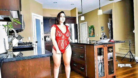 Curvy brunette in red lace lingerie shaking ass in kitchen BTS