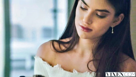 Stefany Kyler in sultry off-shoulder sweater, long brunette hair, gazing seductively