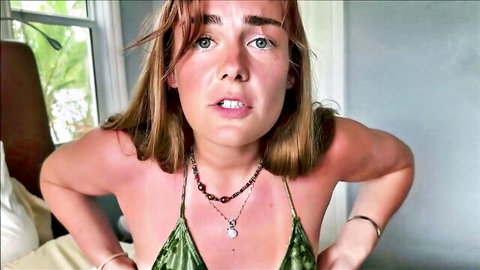 Young woman in green bikini top with surprised expression in Family Therapy XXX