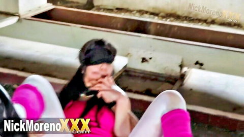 Nick Moreno blindfolded in ecstasy, pink top white pants legs spread