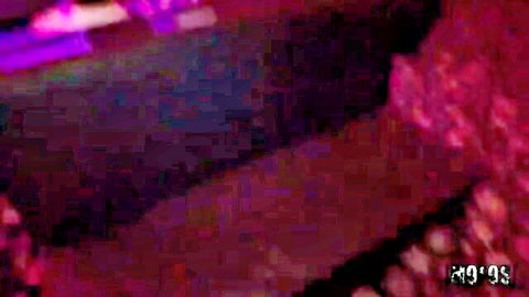 Sexy Caucasian stripper teasing in pink lingerie on neon purple lit stage at strip club