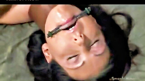 Brunette BDSM slave with ring gag drooling mouth open upside down for deep throat