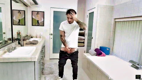 Tattooed man pulls down jeans exposing cock in Christie Stevens series