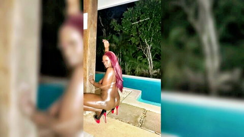 Ebony redhead stripper masturbates by pool in red heels