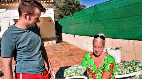 Maggie Moon in floral dress seduces young Sam Bourne poolside