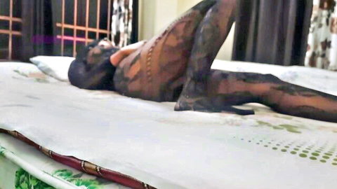 Indian woman in black lace stockings, seductive lounge on bed