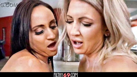 Gigi Dior and Alyssia Vera in steamy close-up kiss, aroused expressions