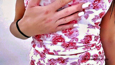 Super hot brunette MILF teases in floral dress, hands on cleavage