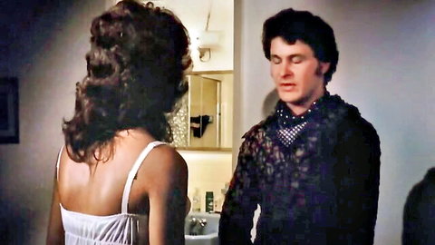 Linda Lovelace in vintage lingerie, seductive pose with lover in Deep Throat scene