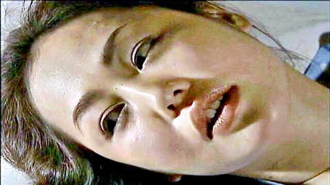Close-up of Asian woman's ecstatic face in JAV adult video
