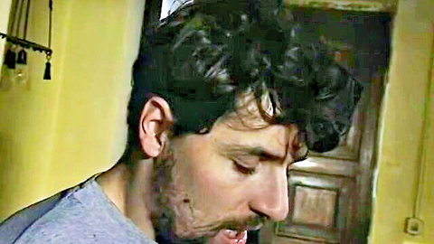 Bearded Italian man in tense profile view from 1995 adult film Against The Mafia 2 with Anita Dark