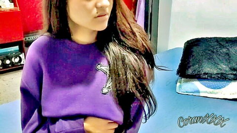 Latina woman in purple hoodie with long hair, teasing before ass fuck