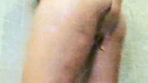 Close-up of woman's pale ass cheeks spread exposing her tight pink puckered asshole