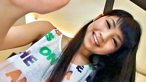 Rina Nagai smiling in One Piece tank top, softcore Japanese beauty