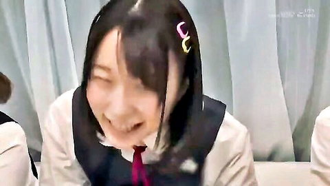 Cute Japanese schoolgirl in uniform smiling excitedly