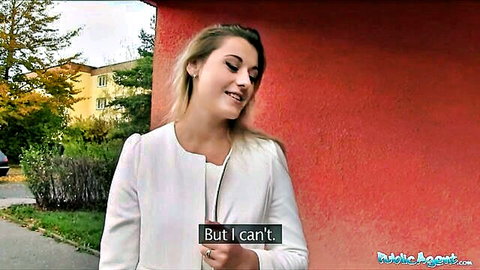 Agnes White smiling in white blazer outdoors for Public Agent video