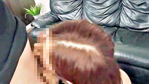 Censored brunette woman viewed from behind on black leather couch with green plant