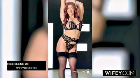 Curvy redhead MILF posing seductively in black lace lingerie with big tits and tattoos