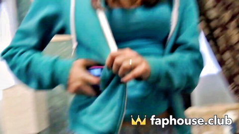 Busty babe in teal hoodie pulls it open flashing huge tits and hard nipples