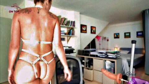 Curvy woman in white strappy lingerie exposed ass approaching sex machine