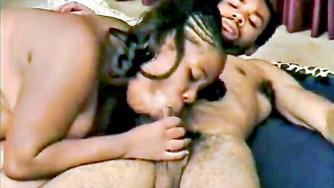 Ebony woman with braids sucking thick black cock on bed