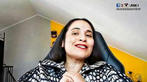 Smiling brunette Latina woman in patterned jacket, lesbian video thumbnail